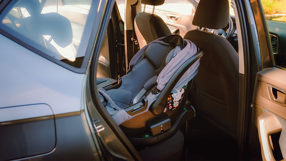 A baby car seat in the back seat of a car A baby car seat in the back seat of a car