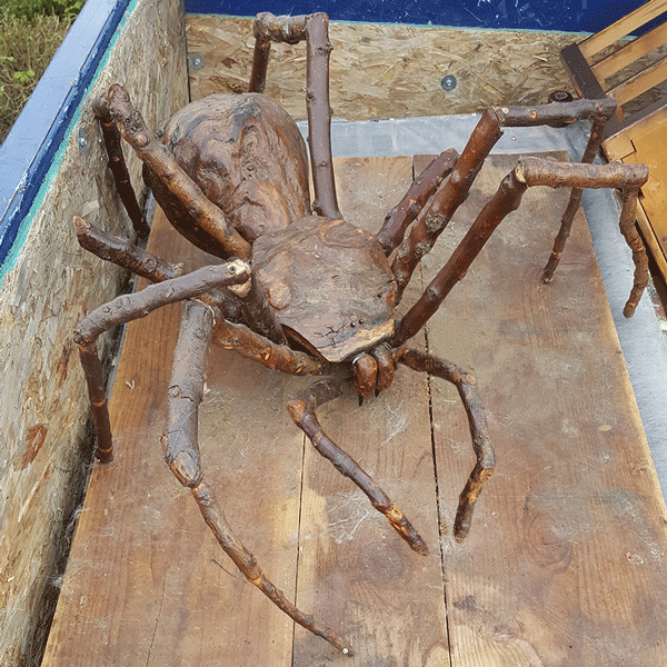 Wooden carved spider on a truck Wooden carved spider on a truck