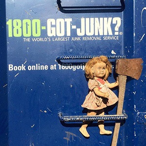 Old doll with Axe on 1-800-GOT-JUNK? truck Old doll with Axe on 1-800-GOT-JUNK? truck