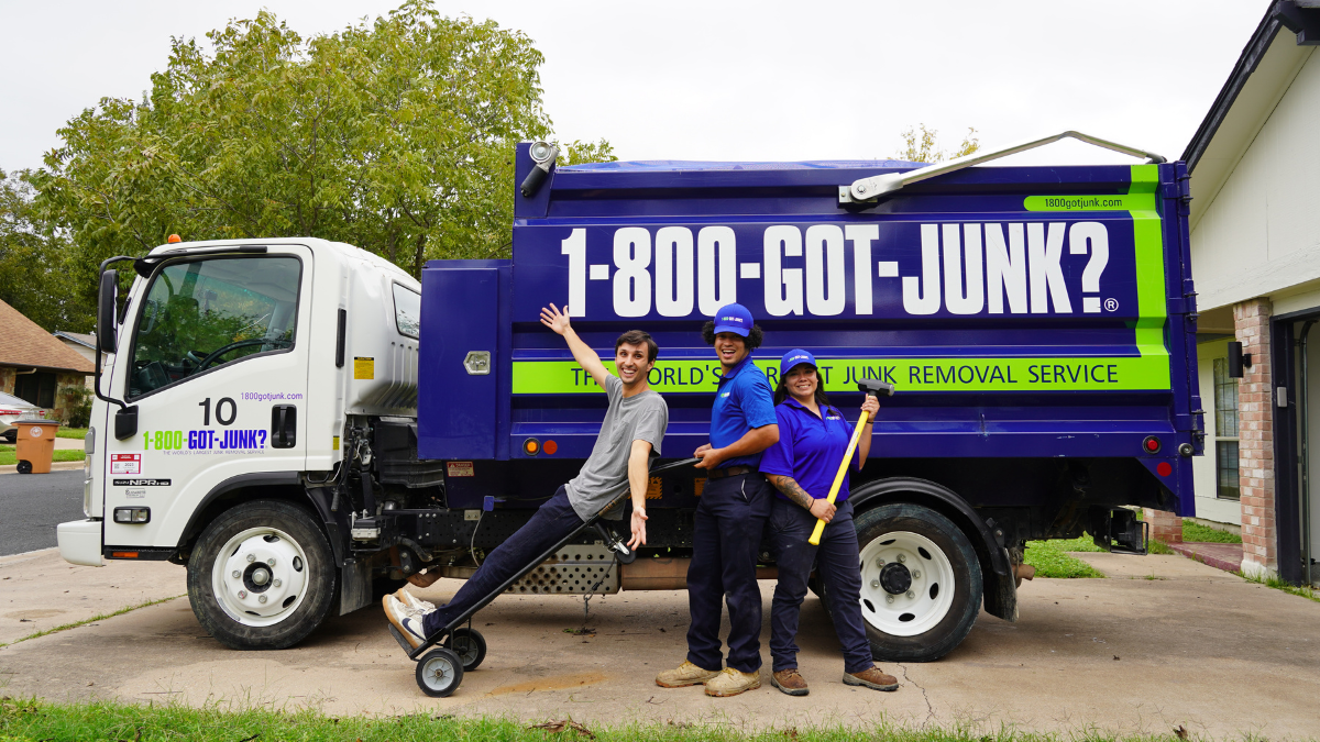 Dawson DIY Top Image Dawson DIY with 1-800-GOT-JUNK? team members standing in front of a junk removal truck smiling