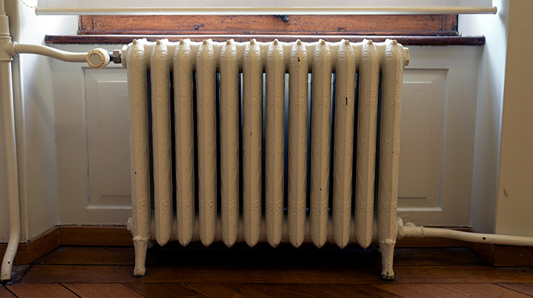 An old cast iron heater scrap ready to be recycled An old cast iron heater scrap ready to be recycled