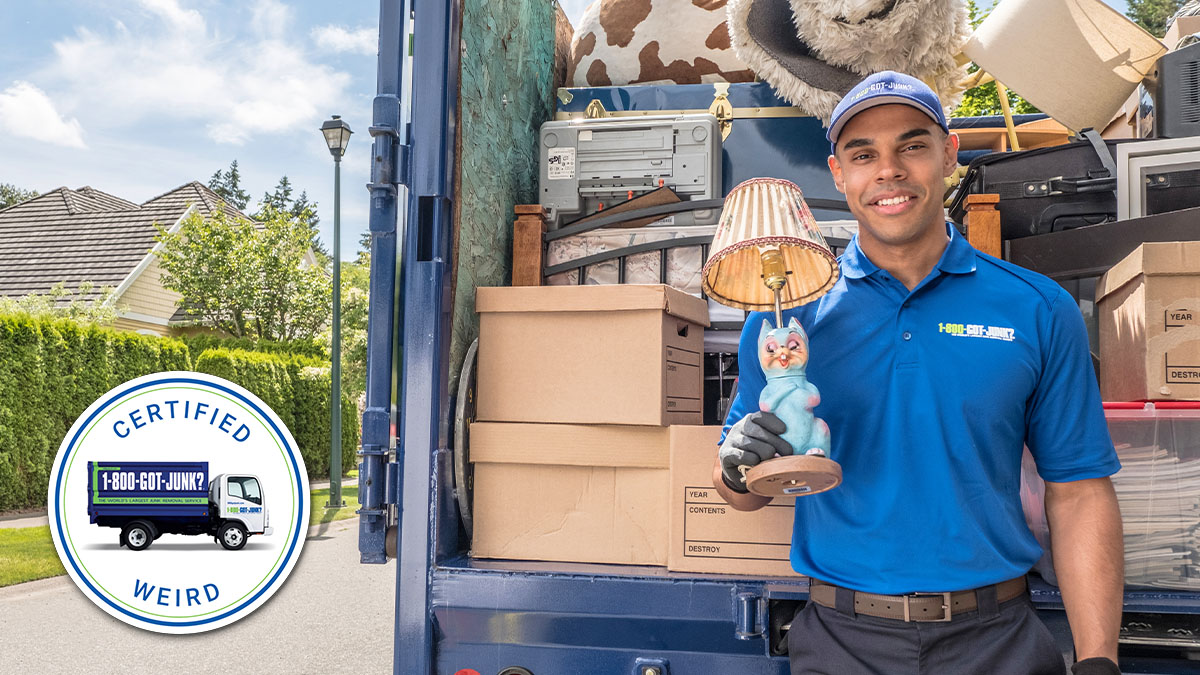 1-800-GOT-JUNK? Truck Team Member holding a weird lamp 1-800-GOT-JUNK? Truck Team Member holding a weird lamp