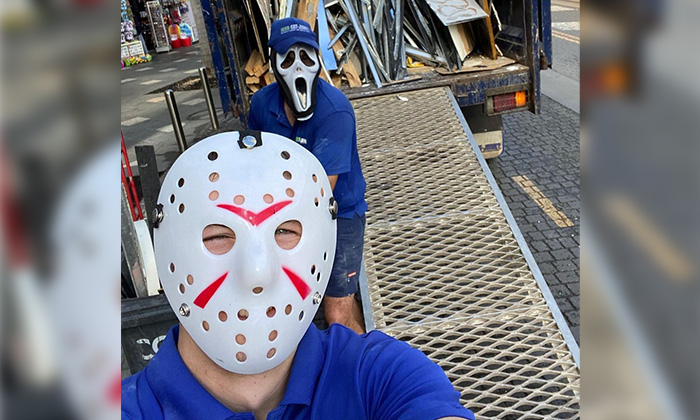 Two 1-800-GOT-JUNK? Truck Team Members in Friday the 13th Masks