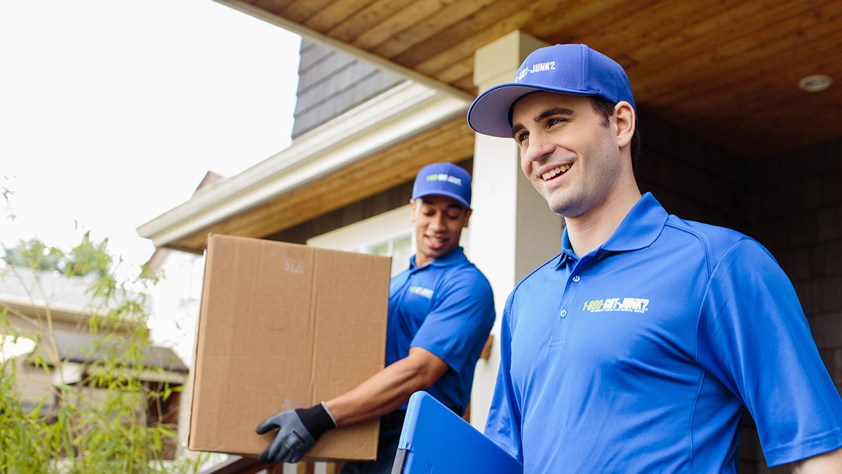 Two smiling 1-800-GOT-JUNK? Truck Team Members Two smiling 1-800-GOT-JUNK? Truck Team Members