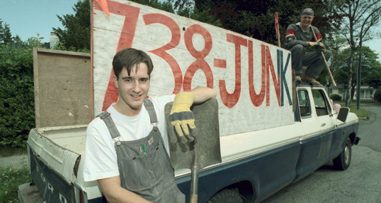 Young Brian Scudamore posing with his first junk truck Young Brian Scudamore posing with his first junk truck