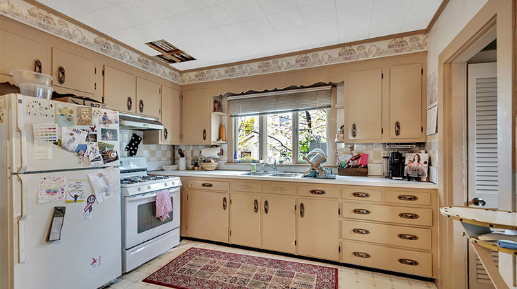 kitchen with beige cupboards and white appliances kitchen with beige cupboards and white appliances