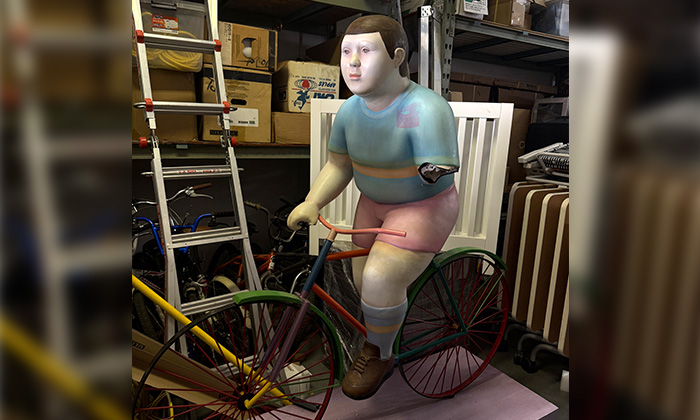 A kid on a bike statue