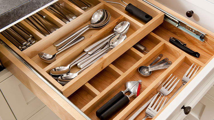 Utensils neatly organized in a drawer Utensils neatly organized in a drawer