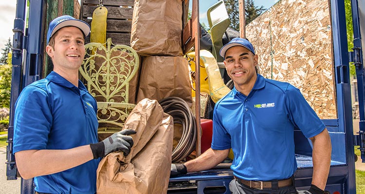 TOMs putting junk into the 1-800-GOT-JUNK? truck TOMs putting junk into the 1-800-GOT-JUNK? truck