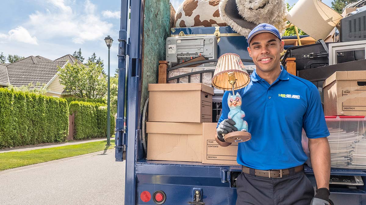 Truck Team Member holding a weird cat lamp Truck Team Member holding a weird cat lamp