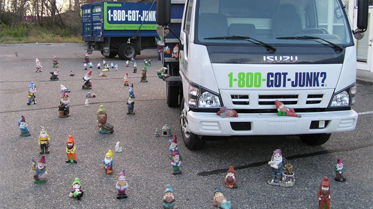 1-800-GOT-JUNK? truck surrounded by lawn gnomes 1-800-GOT-JUNK? truck surrounded by lawn gnomes
